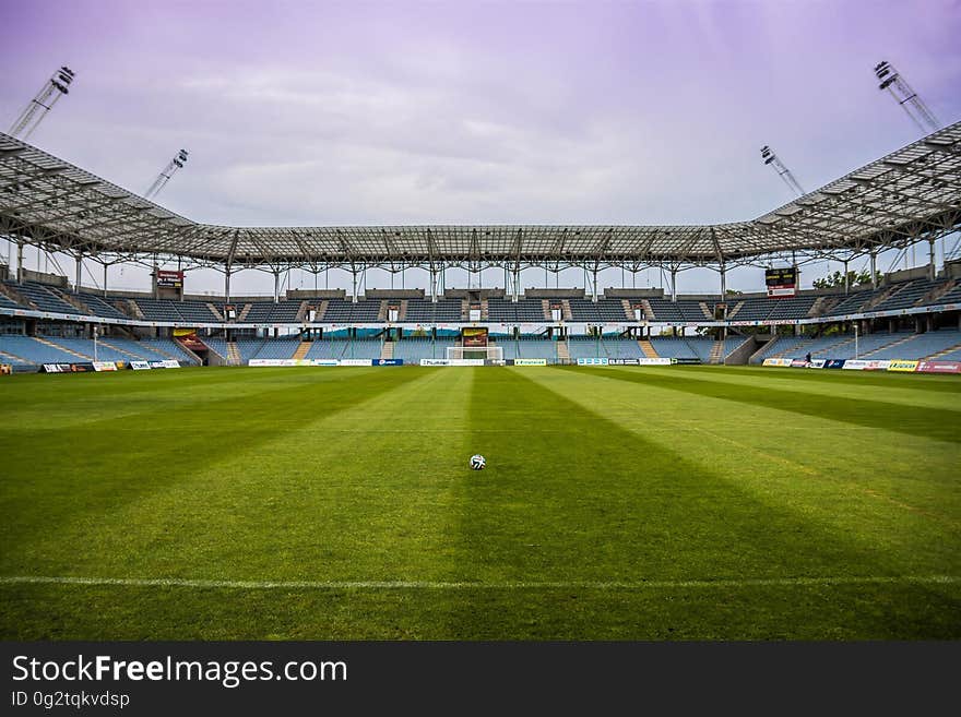 Soccerball on Wide Green Grass Field