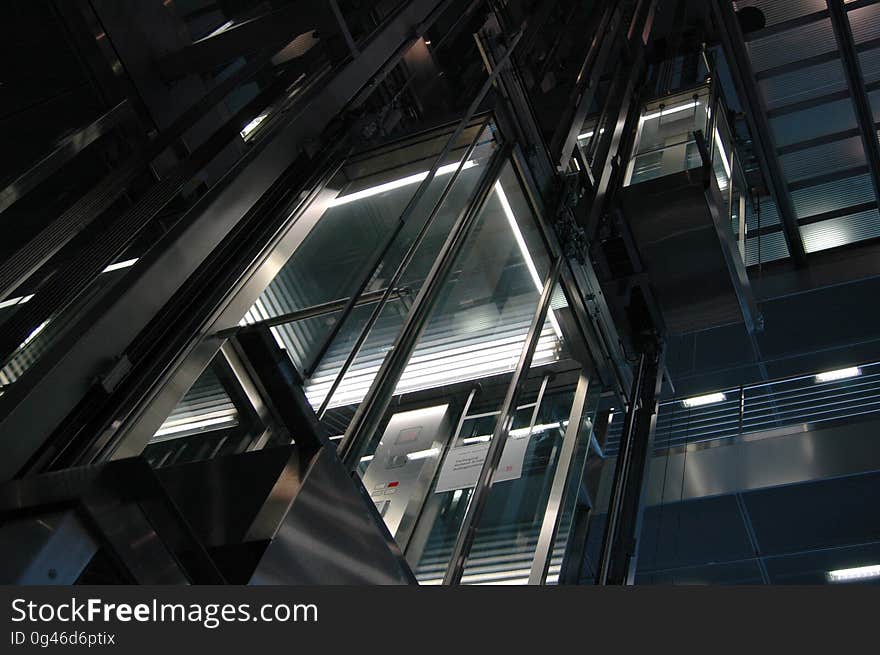 Lights on exterior of modern building at night.