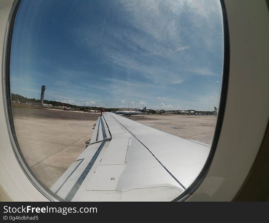 A view inside the plane on the runway at Aeroporto Internacional de Salvador in Bahia. A view inside the plane on the runway at Aeroporto Internacional de Salvador in Bahia.