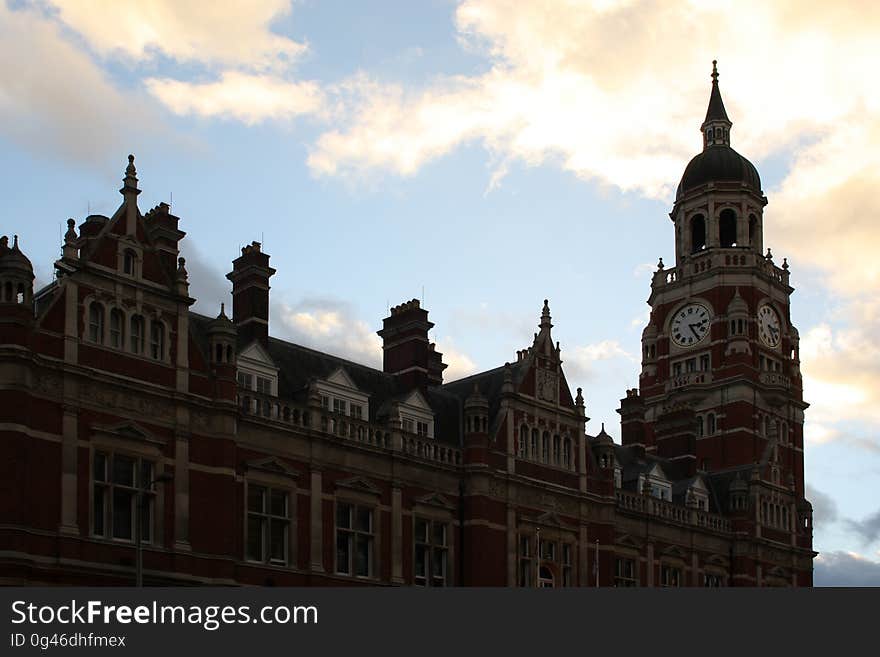 Exterior of a historic building with a clocktower,. Exterior of a historic building with a clocktower,