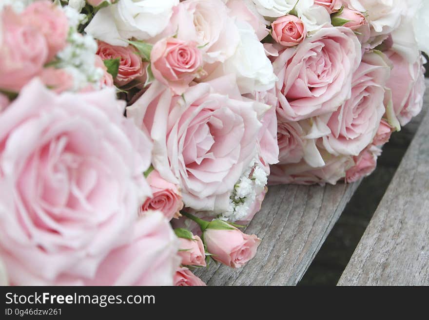 A close up of pale pink rose wedding bouquets.