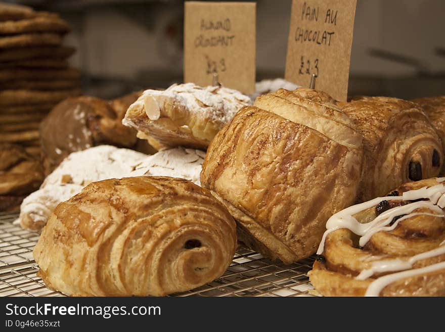 Close up of sweet croissants in a bakery. Close up of sweet croissants in a bakery.