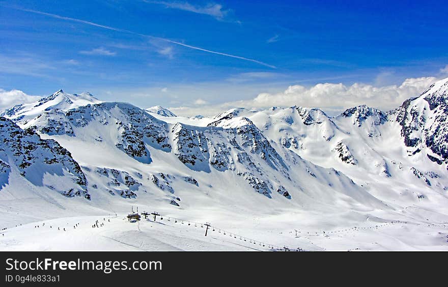 Mountain panorama in the winter with a ski resort on the slopes. Mountain panorama in the winter with a ski resort on the slopes.