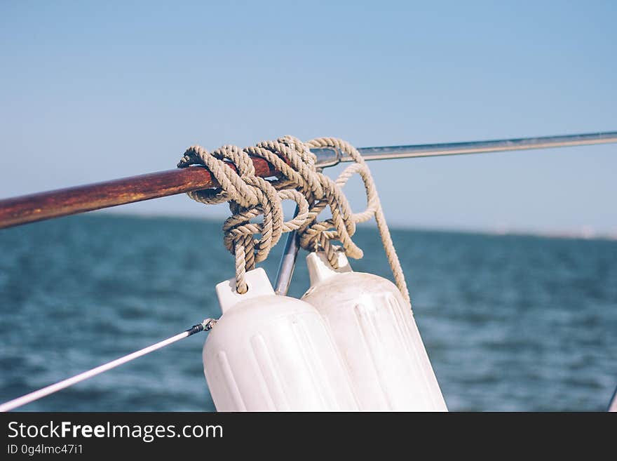 A pair of sleepers hanging from the side of a boat. A pair of sleepers hanging from the side of a boat.