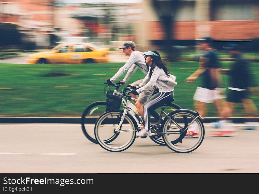 A street with bicyclists and pedestrians. A street with bicyclists and pedestrians.