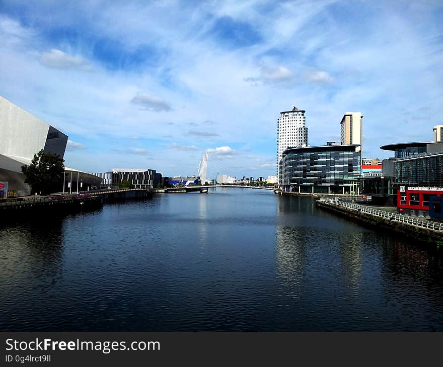 A view from a bridge at a river or canal in a city. A view from a bridge at a river or canal in a city.