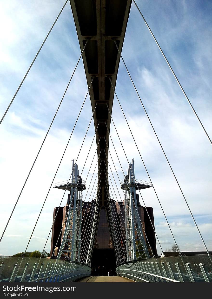 A view of a suspension bridge from the deck.