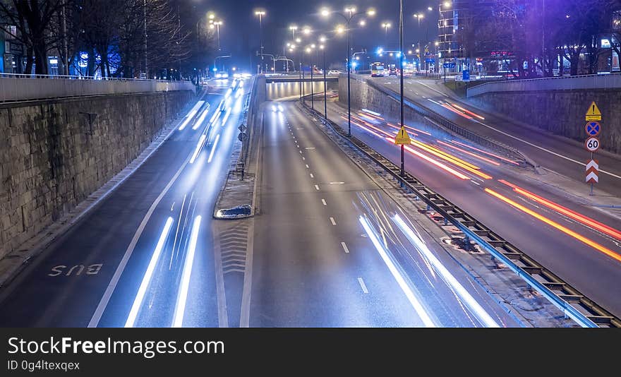 A view of a city with light trails of the traffic. A view of a city with light trails of the traffic.