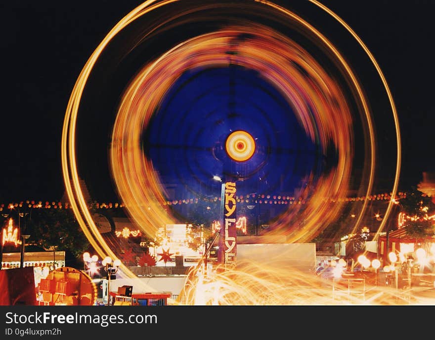 Blur of lights from carnival ride at night. Blur of lights from carnival ride at night.