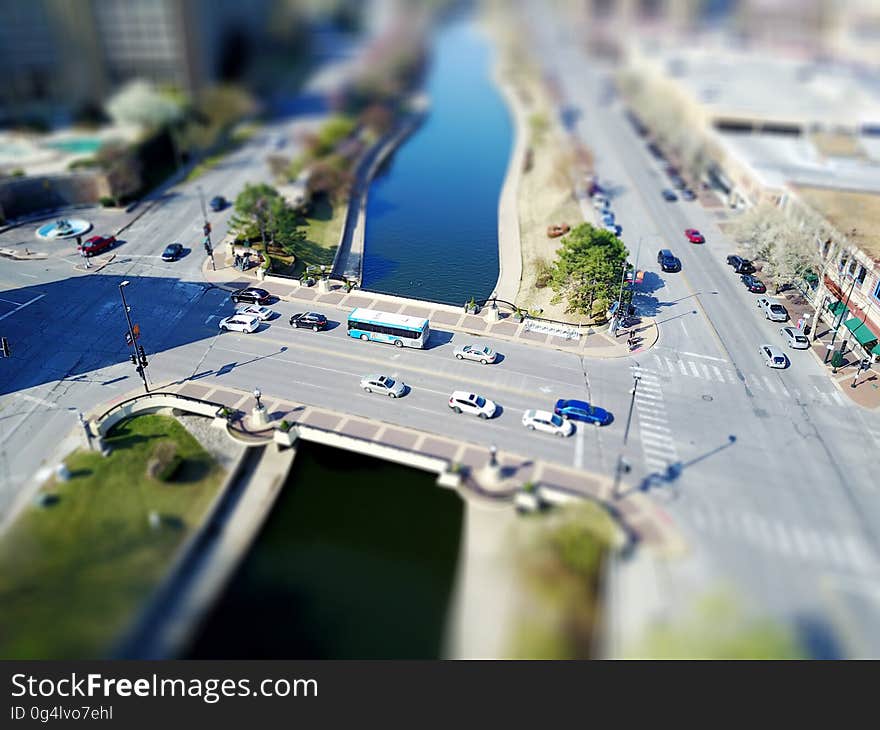 Aerial view over traffic on urban streets and bridge over river. Aerial view over traffic on urban streets and bridge over river.