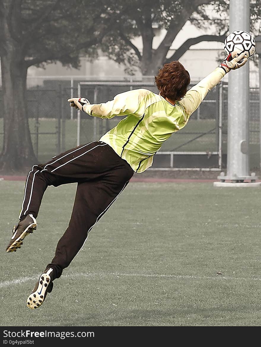 Goalee Player Holding Black and White Soccer Ball