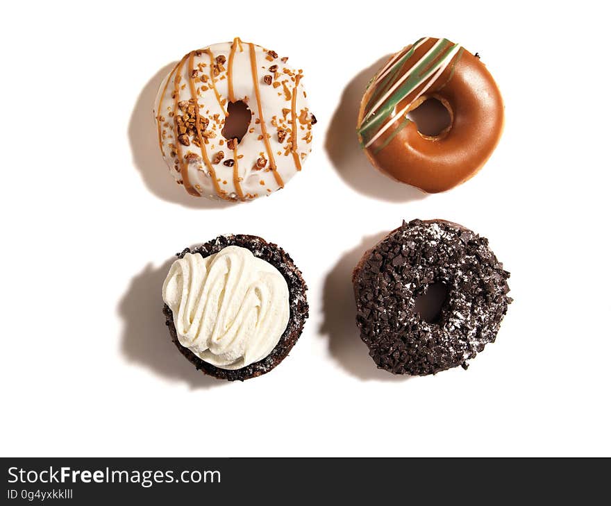 Over view of iced and decorated donuts. Over view of iced and decorated donuts.