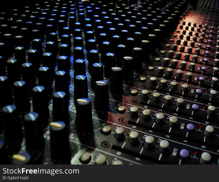 A close up of the buttons on an electronic amplifier.