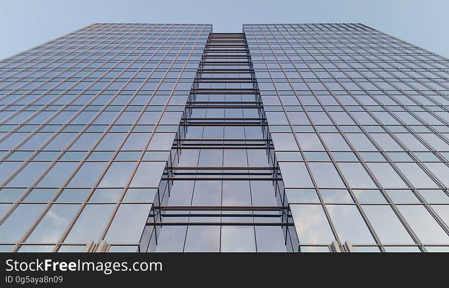 A tall modern office building from the low angle.