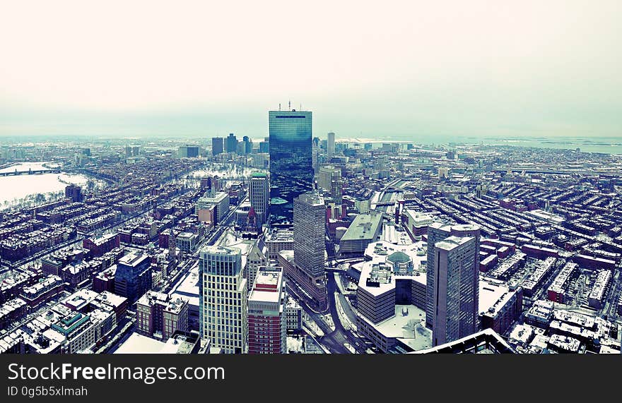 Aerial view of waterfront modern city on sunny day. Aerial view of waterfront modern city on sunny day.