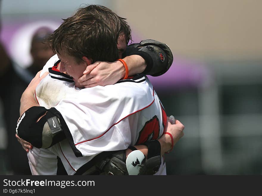 Sports Players Hugging