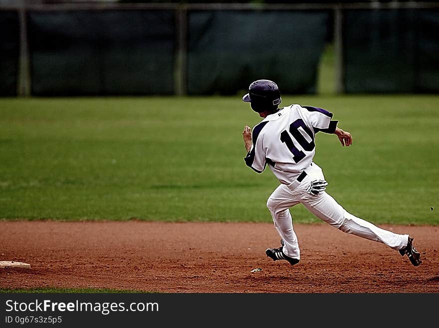 Baseball Player Running on Court