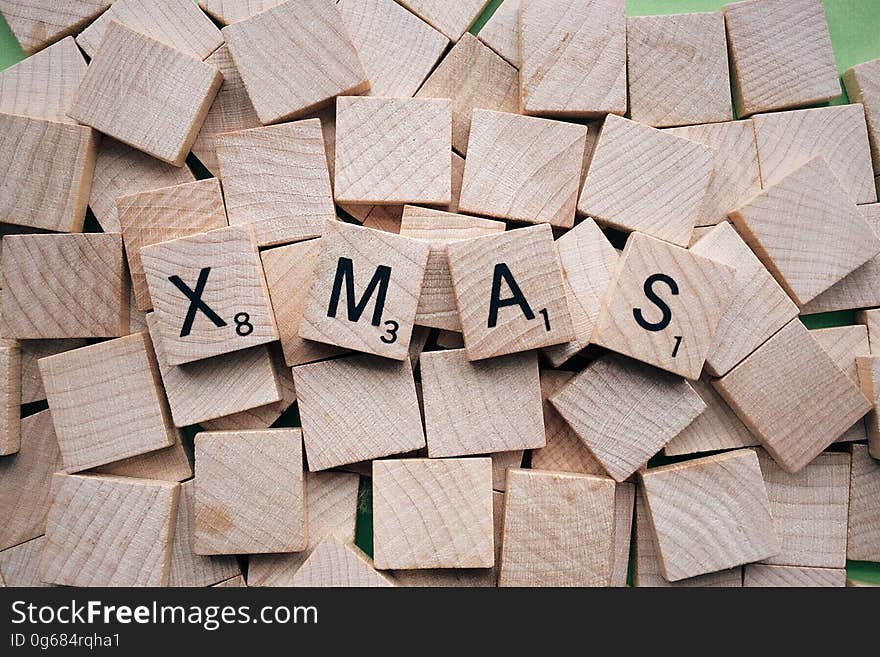 Background of wooden tiles spelling Xmas.