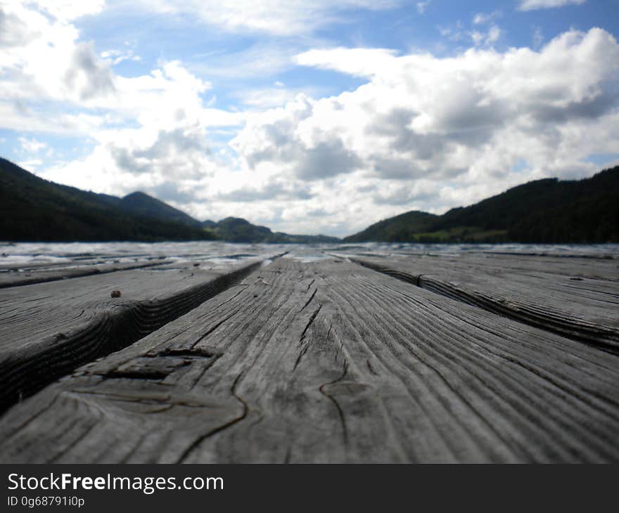 Wooden boards in front of a mountain landscape. Wooden boards in front of a mountain landscape.