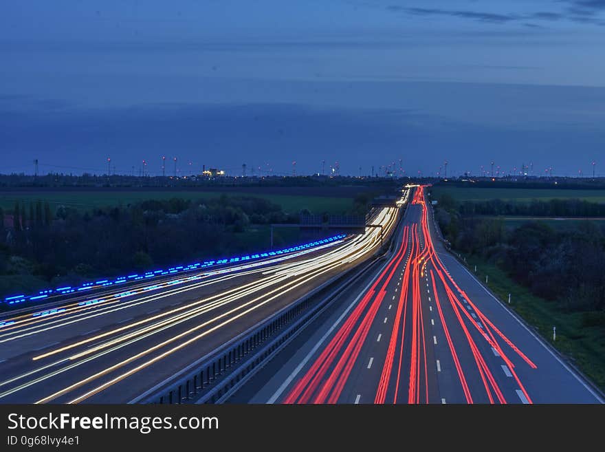 Blur of red and white lights from cars on rural highway. Blur of red and white lights from cars on rural highway.