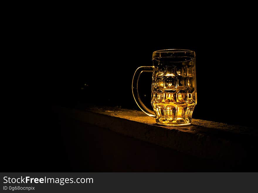 Clear Glass Mug With Beverage during Night Time