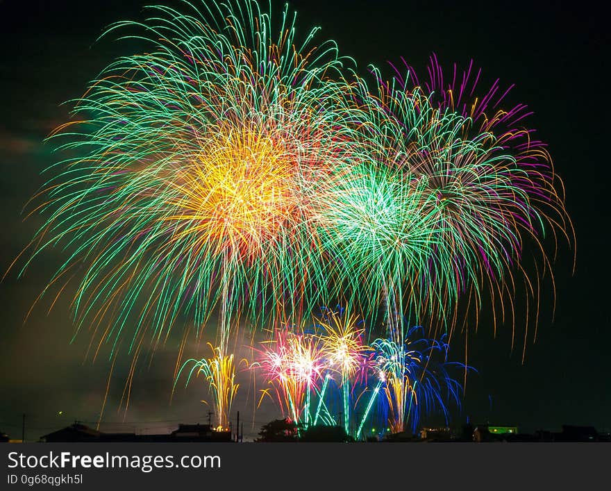 Colorful fireworks burst in night sky. Colorful fireworks burst in night sky.