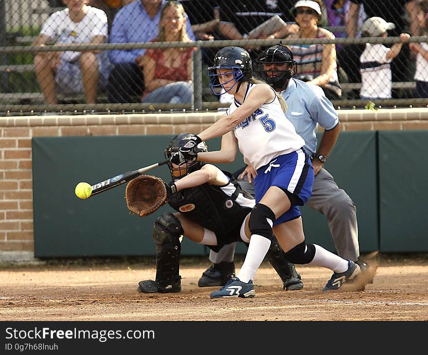 Woman in White Jersey Shirt Playing Baseball during Daytime