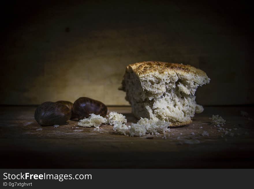 Still life of loaf of crusty bread with fresh fruits on rustic wooden table. Still life of loaf of crusty bread with fresh fruits on rustic wooden table.