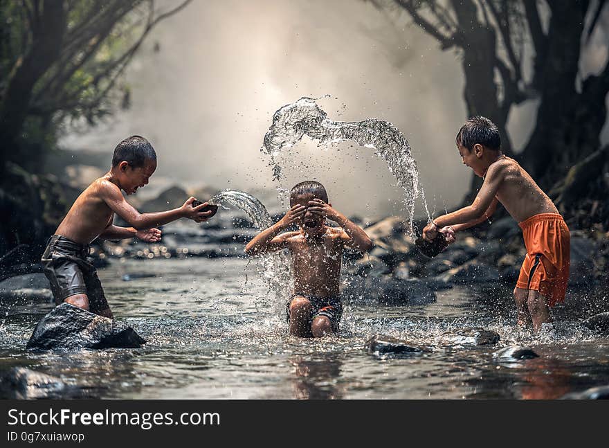 Group of People Splashing Water