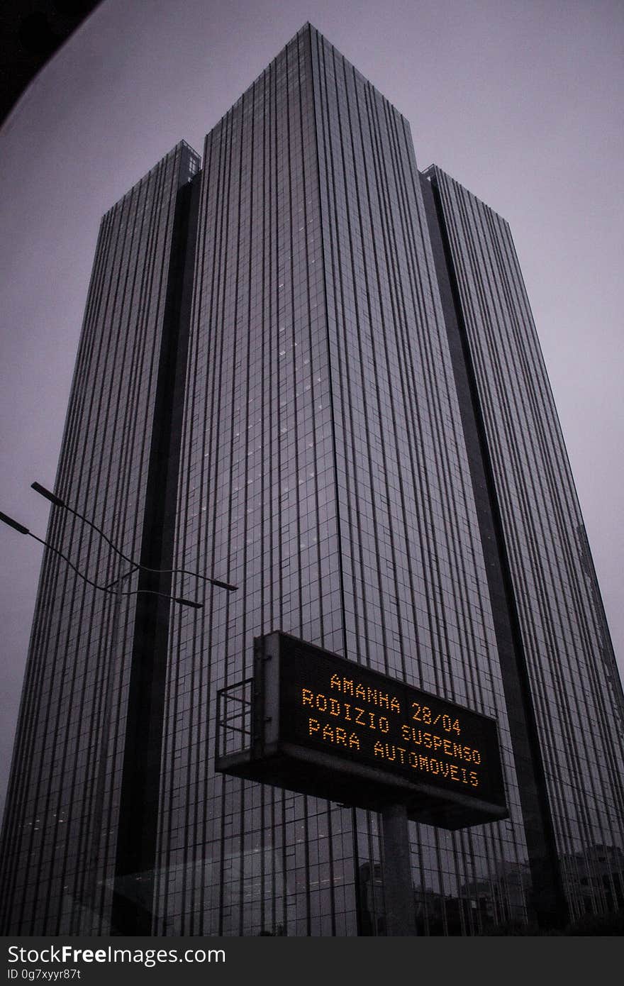 A modern high rise office building from a low angle. A modern high rise office building from a low angle.