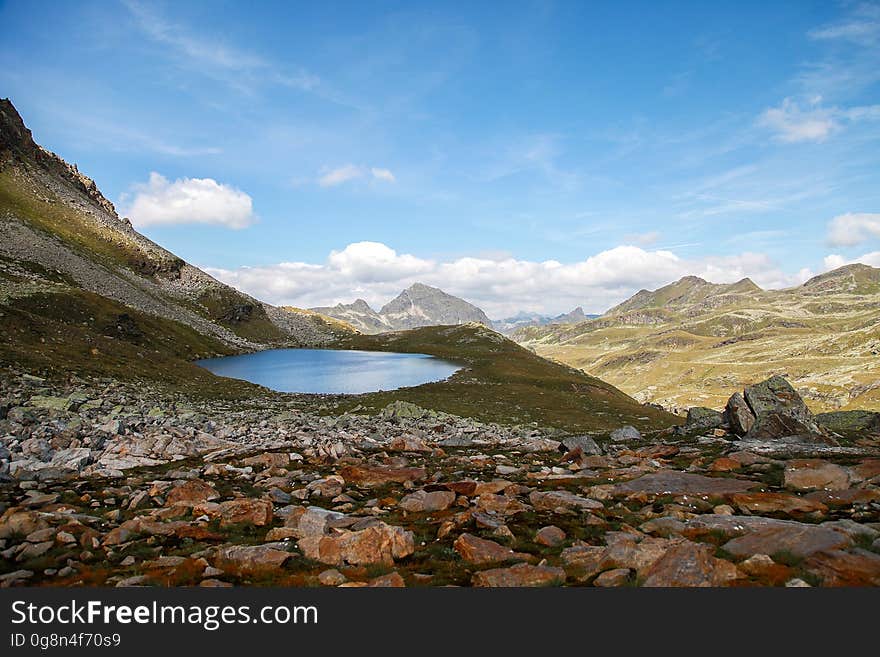 Scenic View of Mountains Against Blue Sky