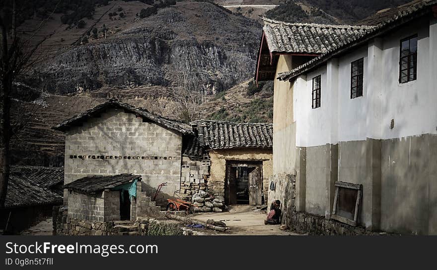 Exterior of stone and brick homes in hills of abandoned village on sunny day. Exterior of stone and brick homes in hills of abandoned village on sunny day.