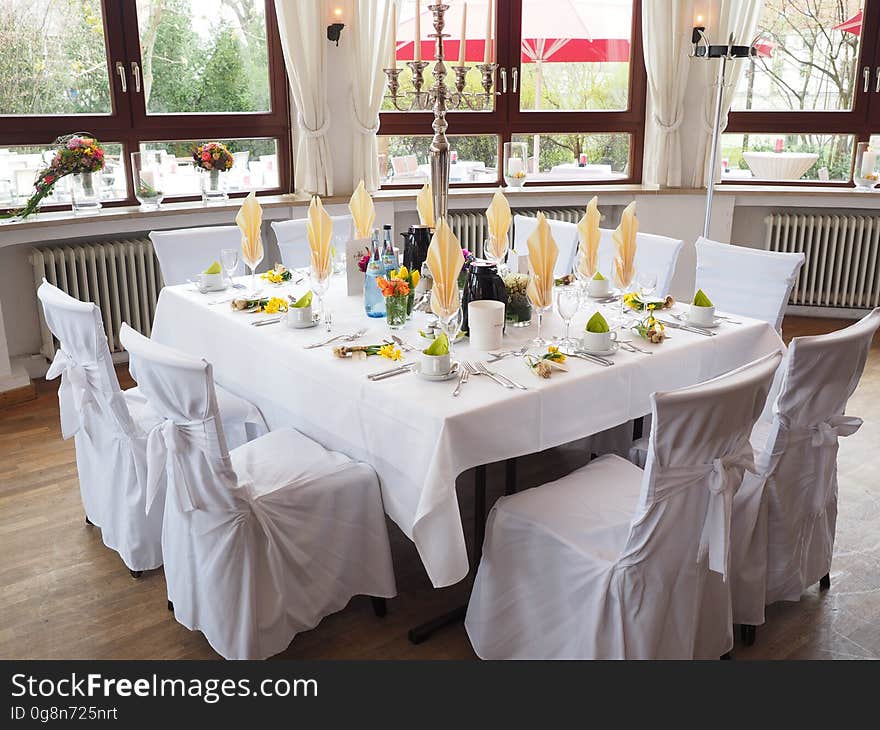 An elegantly set table in a restaurant. An elegantly set table in a restaurant.