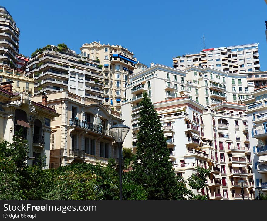 A view of a city with apartment blocks on the hillside.