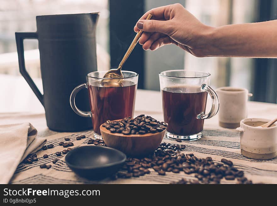 Person brewing coffee in the morning.