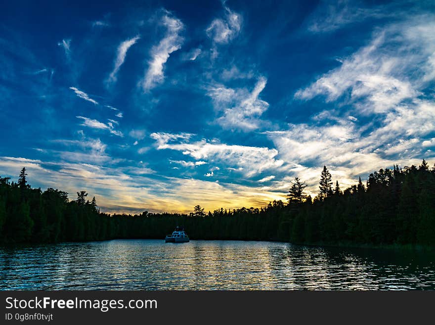 A tranquil lake surrounded by forest