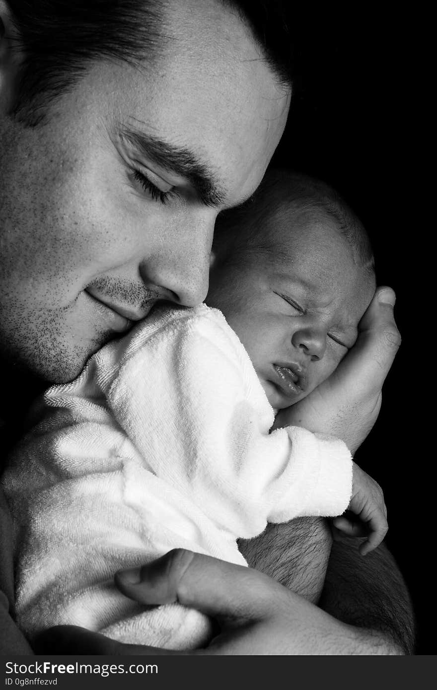 Men Carrying a Baby Greyscale Photography