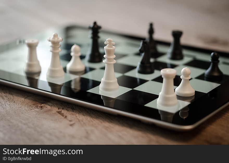 Tilt Shift Lens Photo of Black and White Chess Pieces