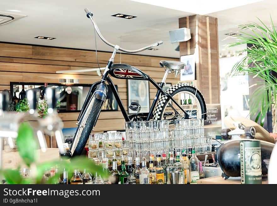 Black Cruiser Bicycle on Bar Table