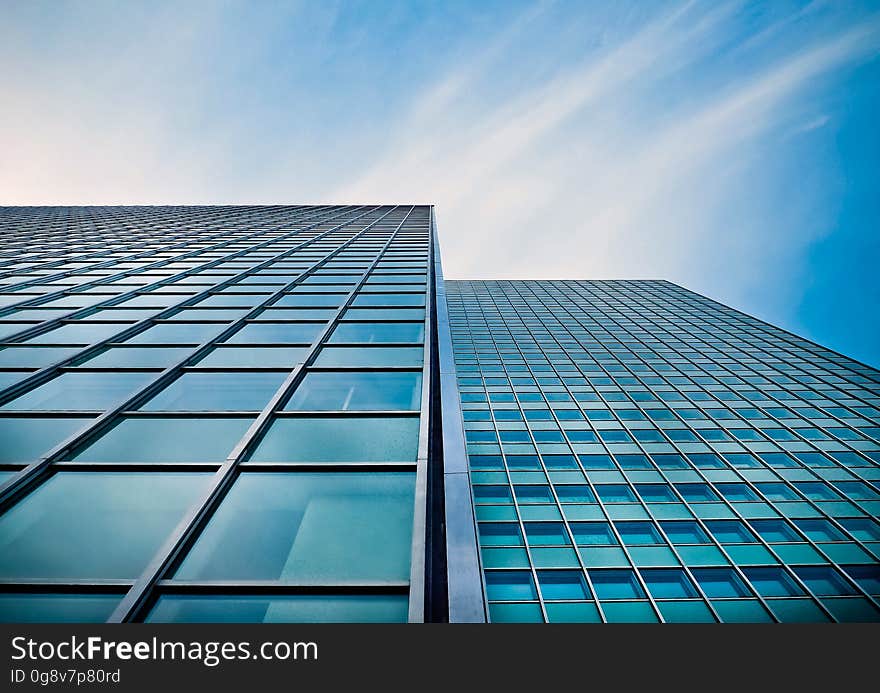 Low Angle View of Office Building Against Blue Sky