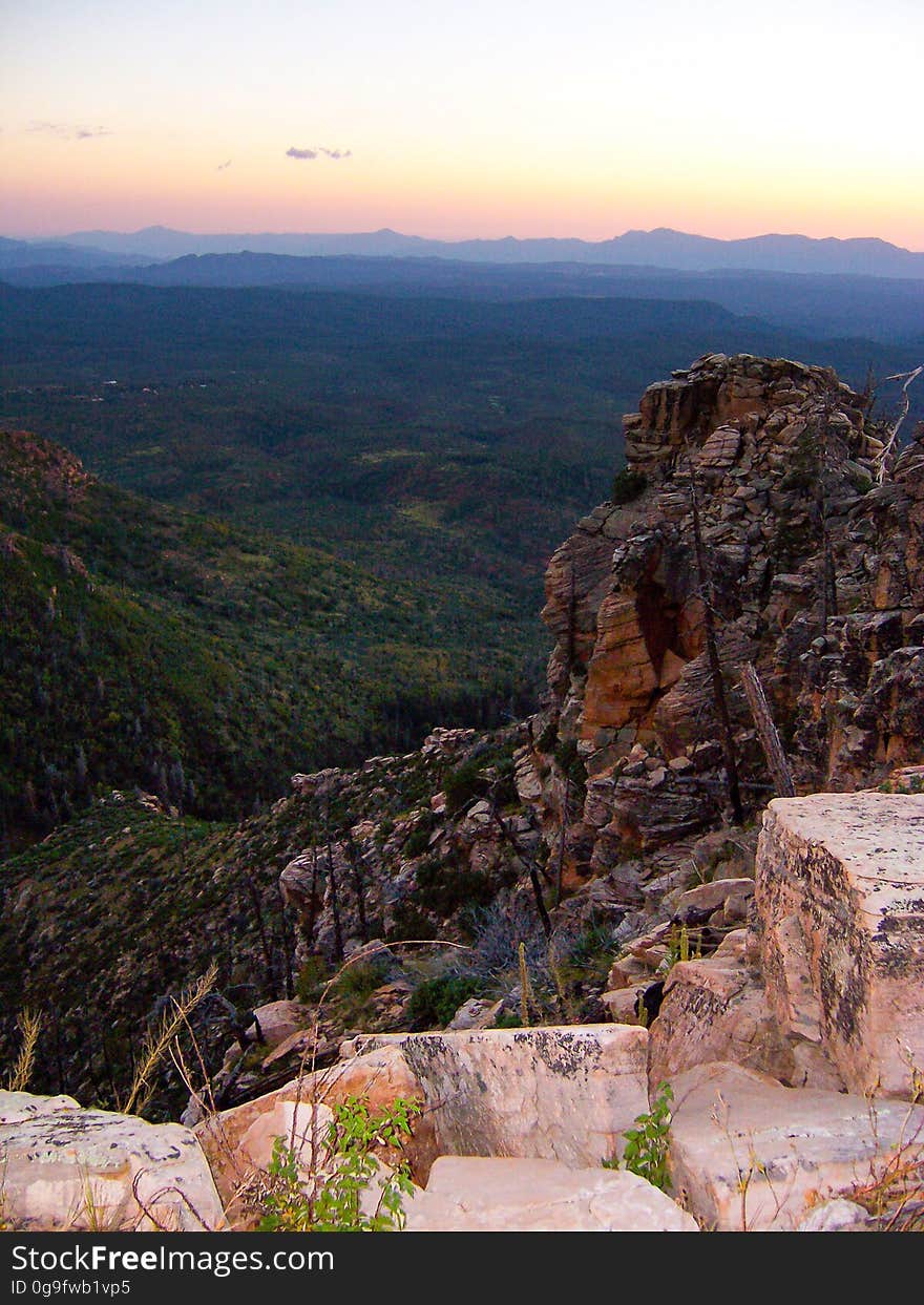 The Mogollon Rim is a rugged escarpment that forms the southern limit of the Colorado Plateau. It extends across the entire forest and provides excellent views within Plateau Country and Desert Canyon Country as well. Dropping as much as 2,000 feet in some areas, the Rim provides some of the most far-reaching scenery in Arizona. Photo by Deborah Lee Soltesz, October 2003. Credit: U.S. Forest Service, Coconino National Forest. Learn more about the Mogollon Rim Ranger District on the Coconino National Forest website.