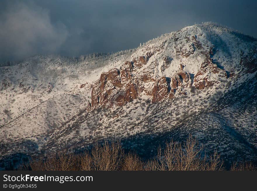 Morning light on Little Elden as a winter storm clears and the clouds begin to break. Little Elden is a peak on the northern side of Mount Elden. Winter storms passed through northern Arizona the first week of January 2016, dropping nearly three feet of snow in some areas around Flagstaff, Arizona. Photo by Deborah Lee Soltesz, January 8, 2016. Source: U.S. Forest Service, Coconino National Forest. Learn more about the Coconino National Forest.