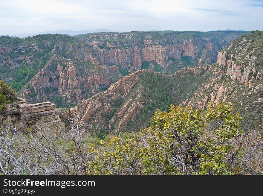 View into Secret Canyon from Little Round Mountain. We headed out of Flagstaff down Woody Mountain Road for a week of camping and day hiking around the Rattlesnake Mesa area. The area is north of Sedona&#x27;s Secret Canyon, on top of the Mogollon Rim. There are several trails, mostly unmaintained, heading along or off the edge of the Rim. For the first day&#x27;s hike, we headed for FS Trail #9, which heads across Little Round Mountain and along the Rim around South Pocket. Read the blog entry for this hike