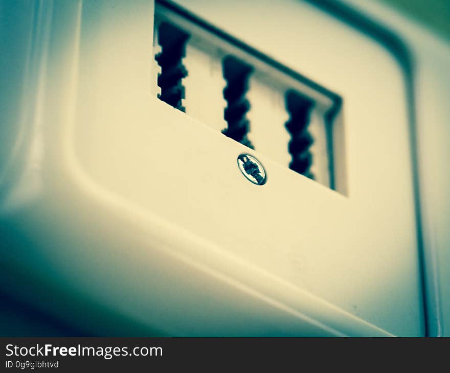 A close up of a white plastic socket. A close up of a white plastic socket.