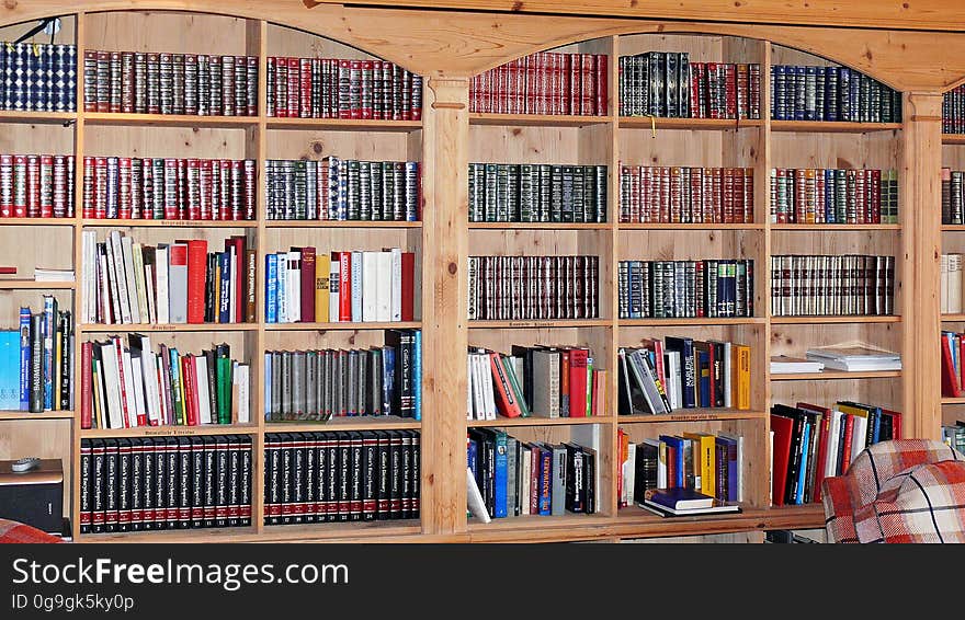 A background of books on the shelves in a library. A background of books on the shelves in a library.