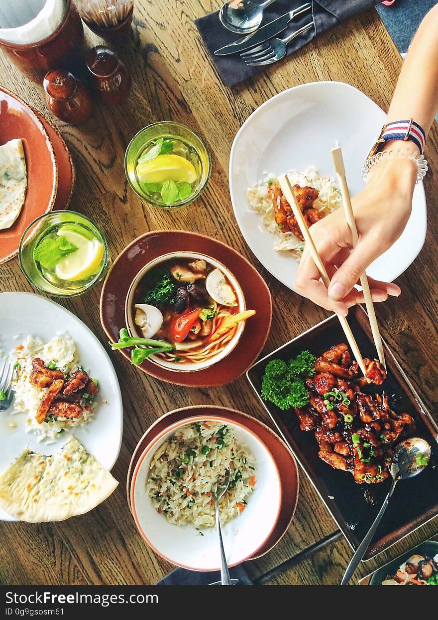 Person Eating Using Chopsticks