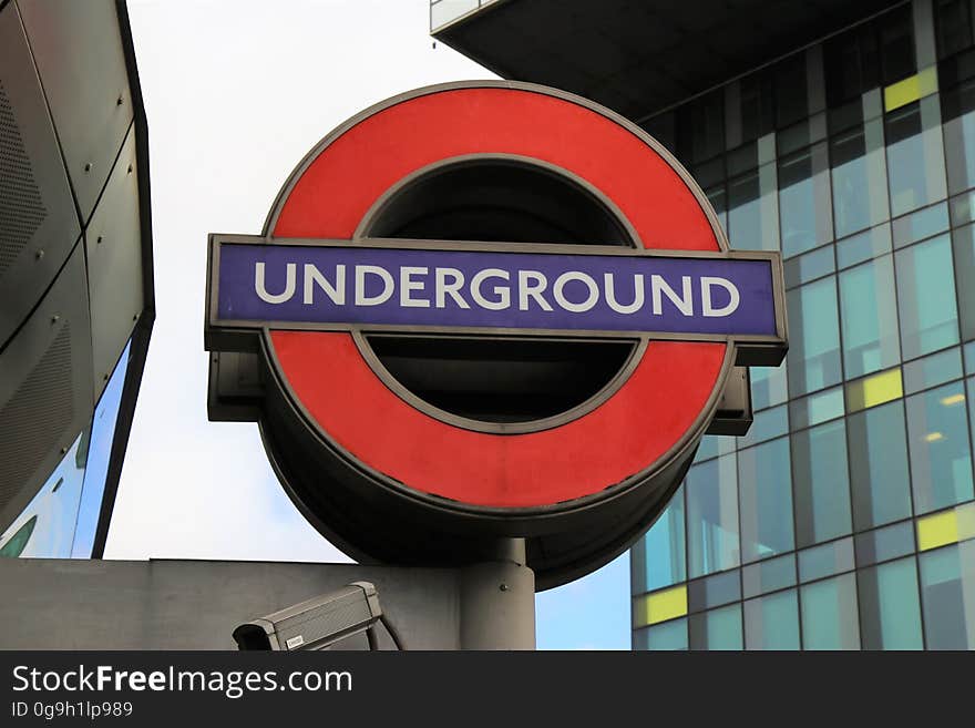 A sign of the London Underground on the street. A sign of the London Underground on the street.