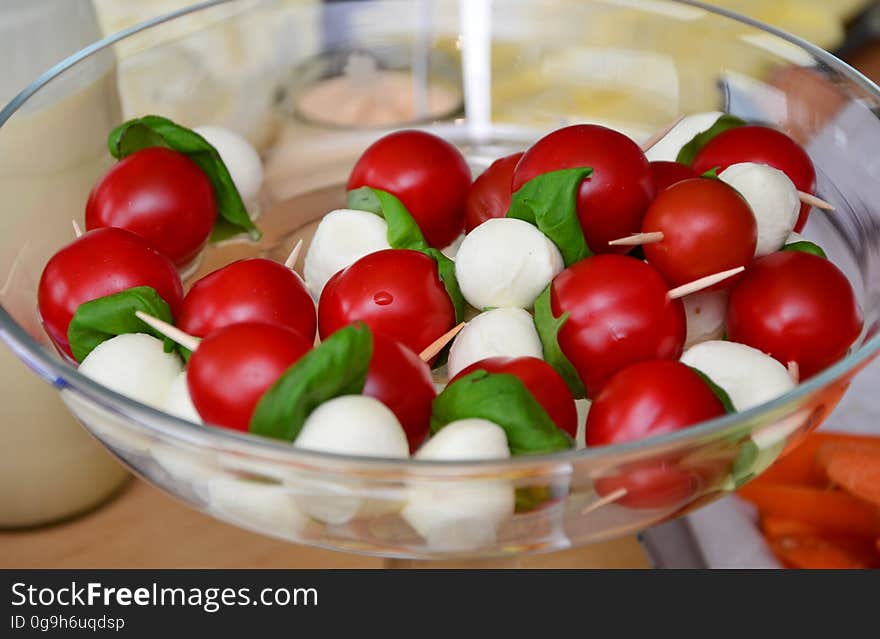 Red Round Fruit Served on Clear Glass Bowl