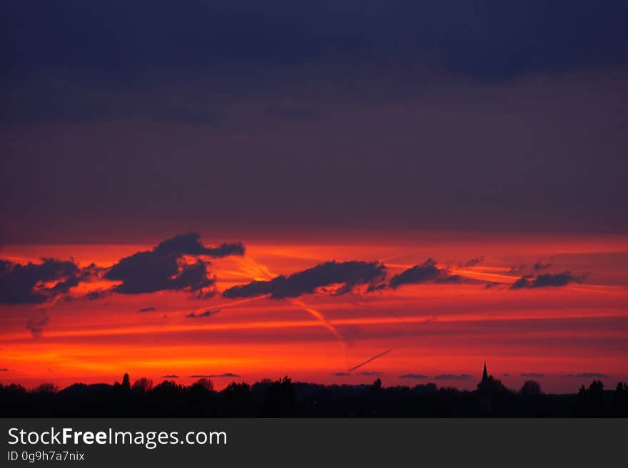 A view of red skies at sunset. A view of red skies at sunset.