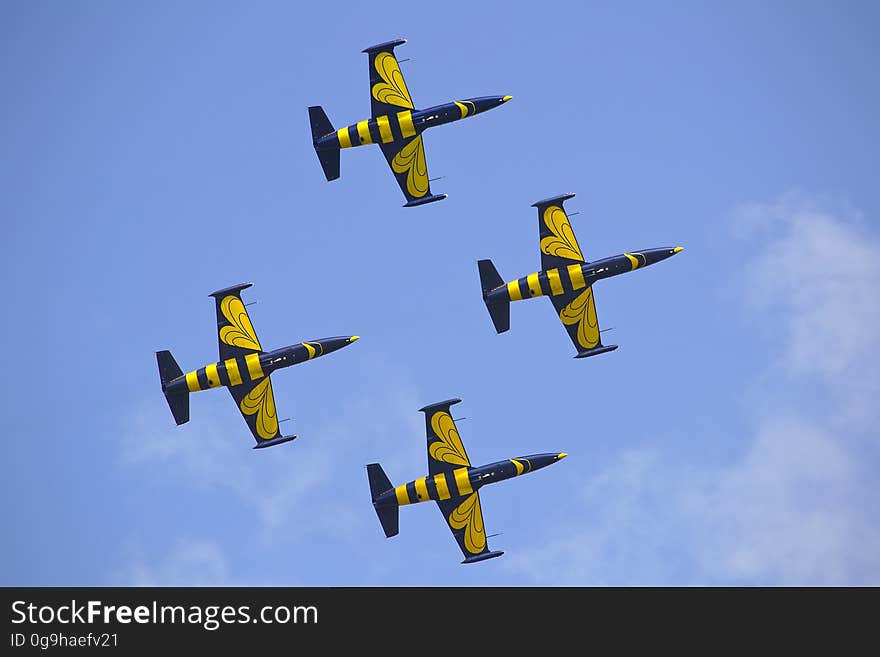 Yellow and Black Air Craft during Blue Sky